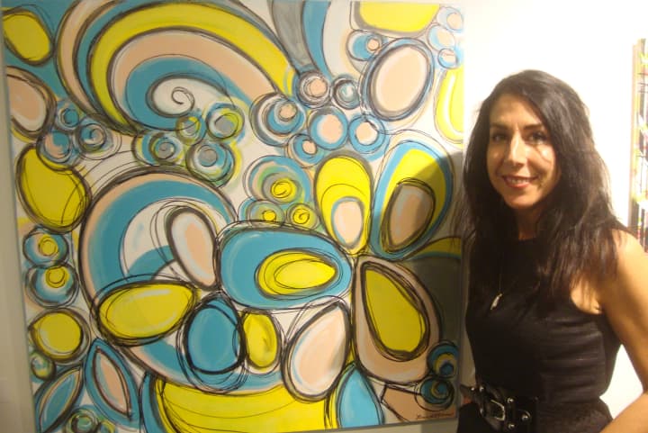 Loren DePalma with her piece &quot;Zeal&quot; which is now on display as part of the &quot;Deja New&quot; exhibit at the Maritime Garage Gallery in Norwalk.