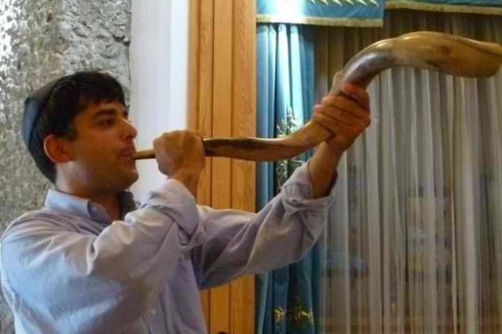 The blowing of the shofar, a Jewish horn used on Yom Kippur and Rosh Hashana.