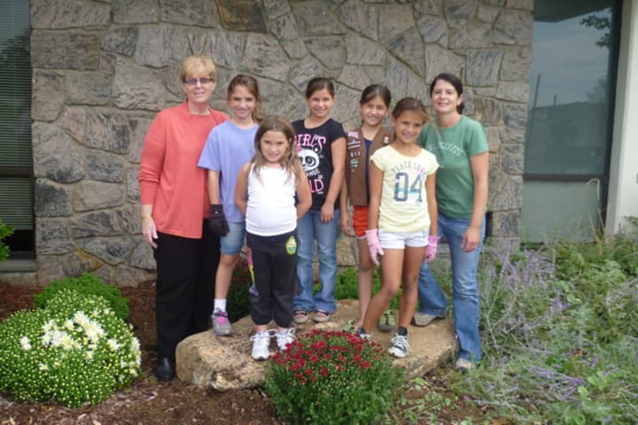 Eastchester and Bronxville Girl Scouts picked up trash and planted flowers as part of the &quot;Paint the Town Gold&quot; initiative. 