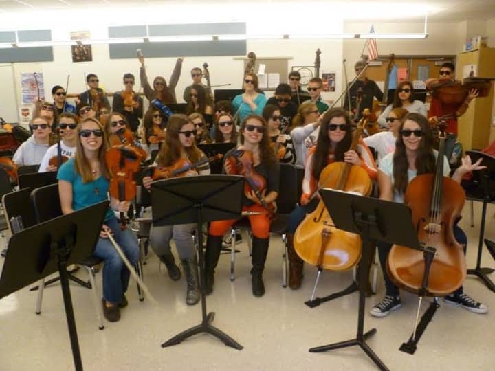 Somers High School&#x27;s orchestra wears the glasses sold to raise awareness last year on World Vision Day. 