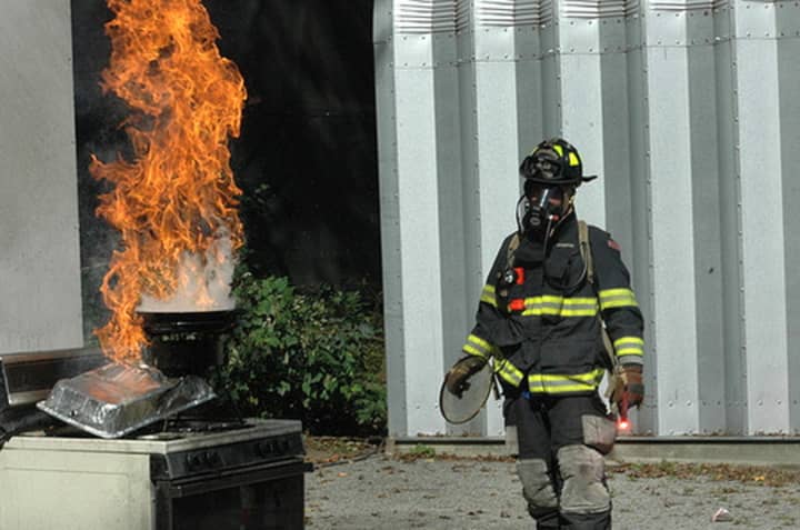 A Scarsdale firefighter demonstrating at a previous fire fair.