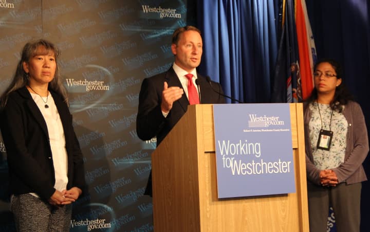 County Executive Rob Astorino flanked by Dr. Ada Huang, left, and Dr. Cheryl Archbald, deputy commissioners in the Health Department.