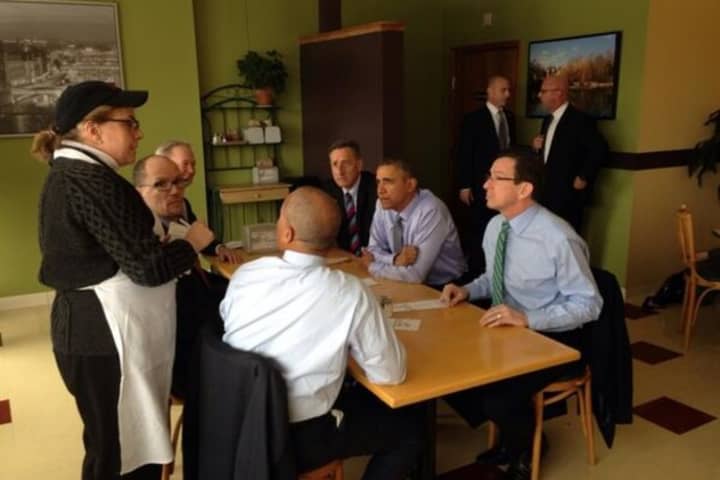 Gov. Dannel Malloy, far right, eats lunch with President Barack Obama before a rally on minimum wage in March in New Britain. 