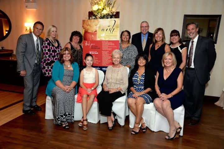 The Make-A-Wish Committee with Wish recipient Lauren Shields (seated, second from left).