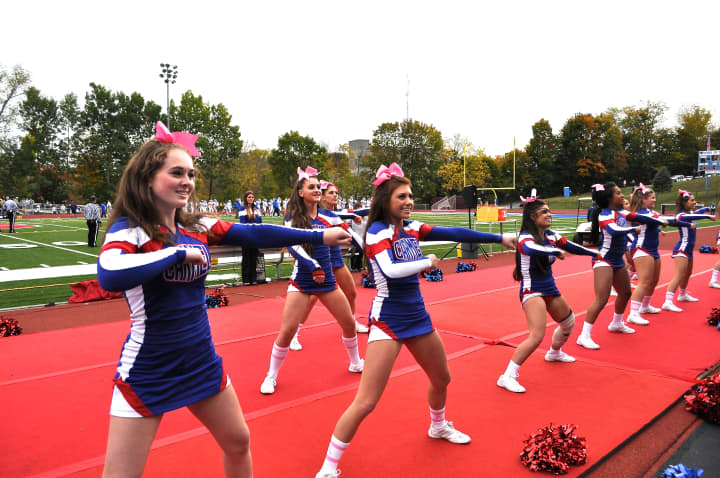 Carmel&#x27;s cheerleader strut their stuff in front of the hometown fans.