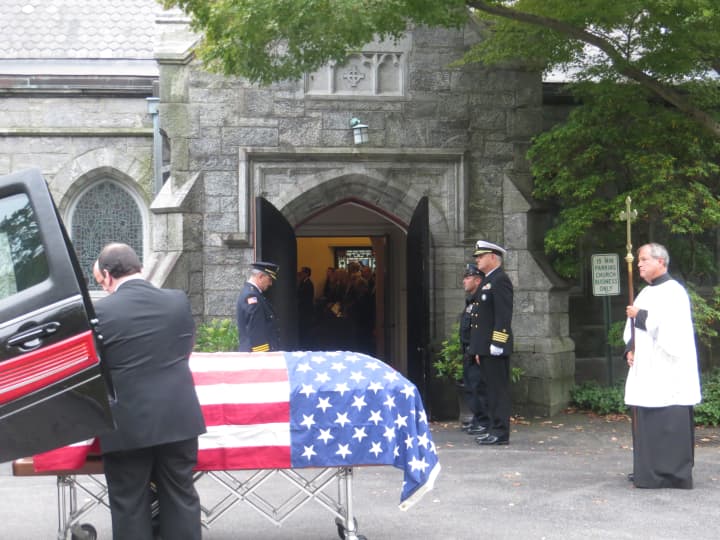 The American flag-draped casket of former Congressman Peter A. Peyser outside of the Church of St. Barnabas before his burial at Sleepy Hollow Cemetery on Monday.