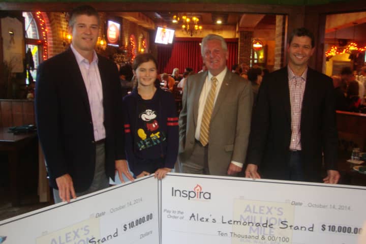 David Pennino, Kennedy Snyder, Mayor Harry Rilling and Jeff Snyder present two $10,000 checks to be donated to Alex&#x27;s Lemonade Stand Foundation at O&#x27;Neill&#x27;s in Norwalk.