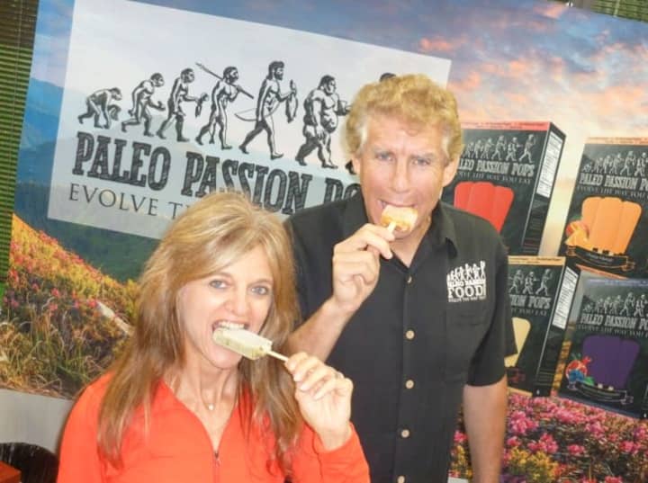 Kim and Marty Sands take a bite out of their Paleo Passion Pops, an all-natural frozen dessert. The Greenwich-based company is selling the popsicles in Fairfield and Westchester counties and Manhattan.