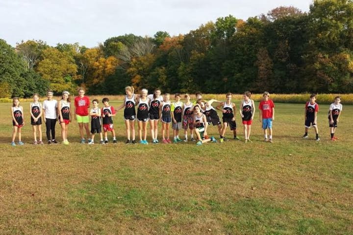 Runners from the New Canaan Blazers youth running team get ready to run in last week&#x27;s cross country meet against St. Aloysisus and St. Luke&#x27;s, where they took eight of the top 10 spots.