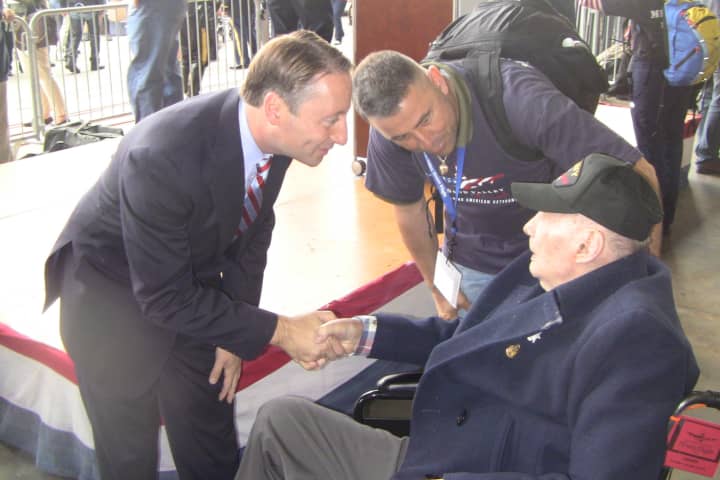 Westchester County Executive Rob Astorino greets a World War veteran on Saturday.
