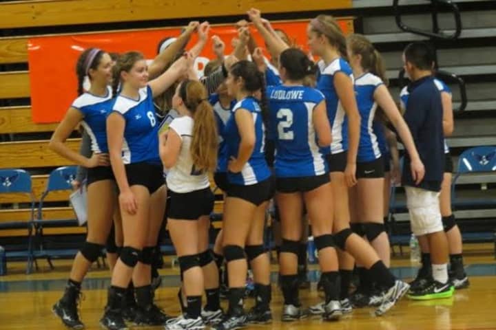 The Fairfield Ludlowe volleyball team gets together before a game.