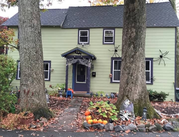 This home at Campwood Grounds in Ossining is all decked out with giant spiders (not just on the front, but on sides) as well as tombstones and skeleton heads and lights. 