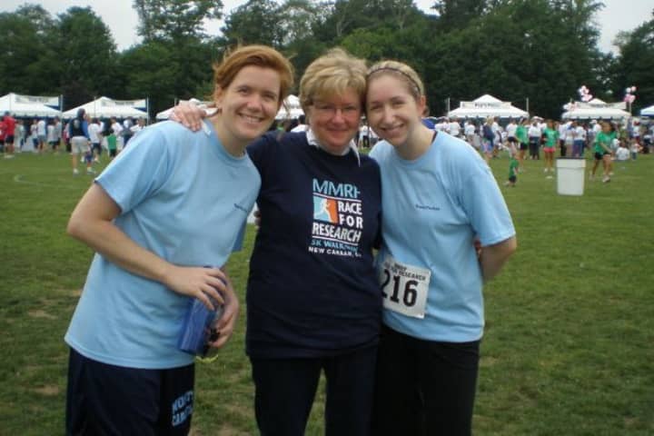 Megan Parker, right, and her sister, Elizabeth, left, stand with their mother, Joan, after a race in 2010. Joan Parker died after a bout with Multiple Myeloma later that year.