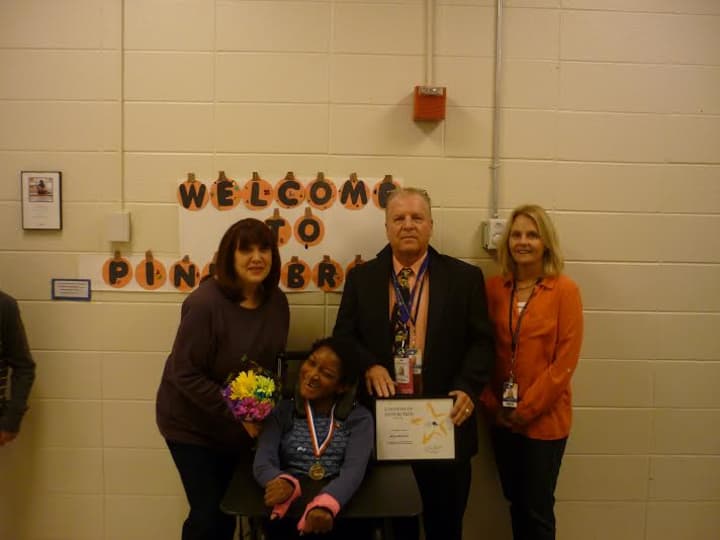 Student of Distinction Alicia Mitchell stands with members of her team at Pines Bridge School, from, occupational therapist Roberta Trotta, Alicia Mitchell, Pines Bridge Principal Bob Kelderhouse and special education teacher Judy Gillet.