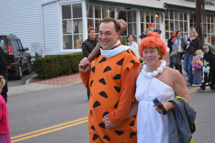 (From 2014): Bedford Hills residents Ryan Archer and Laurie Kelleher march in the Katonah Halloween parade. They are dressed as Fred and Wilma from &quot;The Flintstones.&quot;