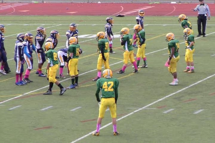 The Norwalk Packers 7th grade football team gets ready to tackle Bridgeport on Saturday. 