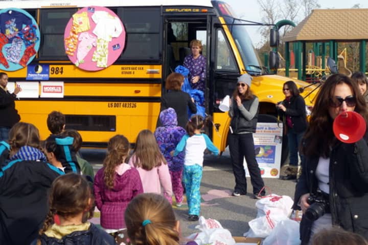 Students and parents will prepare to stuff a bus for the Pajama Program.