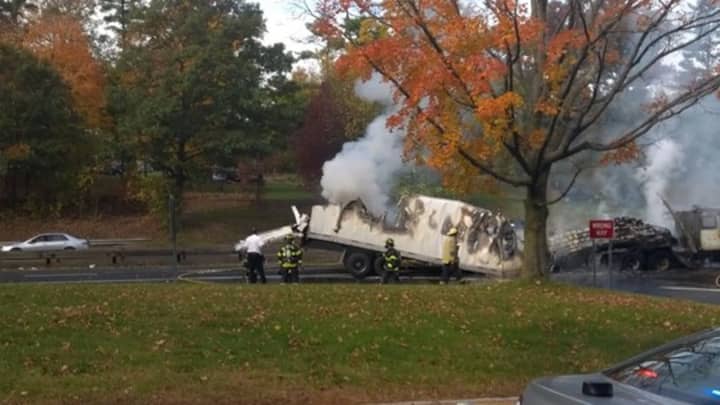 The Greenwich Fire Department put out this truck fire in October 2014 after a truck collided with a Hutchinson River Parkway Bridge in Rye Brook, closing the adjoining Merritt Parkway.