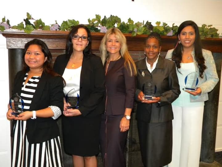 Pictured with The College of New Rochelle President Judith Huntington are (left to right):
Marie Stephanie Gomez, Alice Melcone, Sherlyn Johnson and Claudia Benitez.
