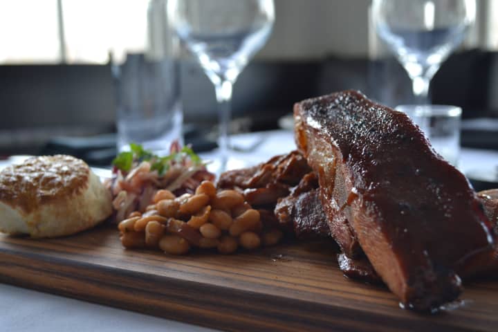 <p>Smoker BBQ ribs at Plates in Larchmont where there is a Louisiana smoker onsite. </p>