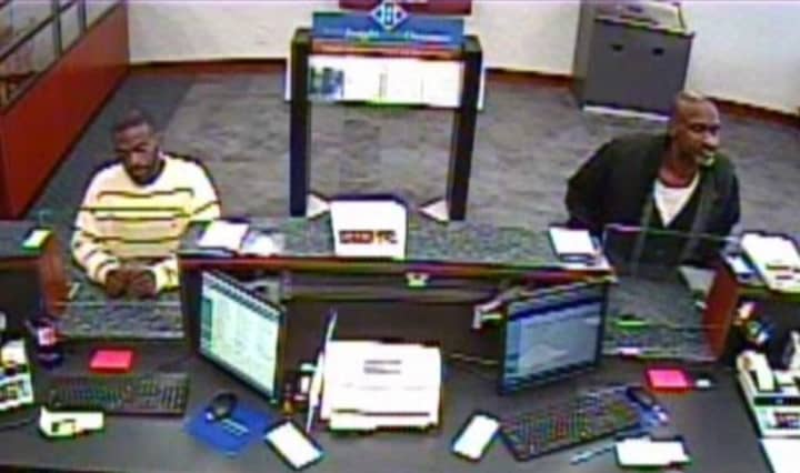 Surveillance footage from the Fairfield bank show the two suspects at the teller&#x27;s counter. Editor&#x27;s note: This photo has been cropped to protect the identity of bank workers.