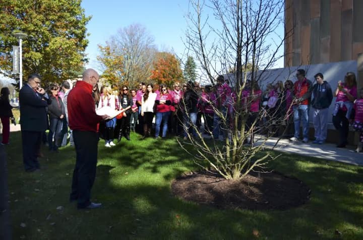 Sacred Heart University Chaplain the Rev. David Buckles, left, speaks during a special tree dedication ceremony in honor of Kaitlyn Doorhy on Oct. 25, just outside of the Chapel of the Holy Spirit on campus in Fairfield.