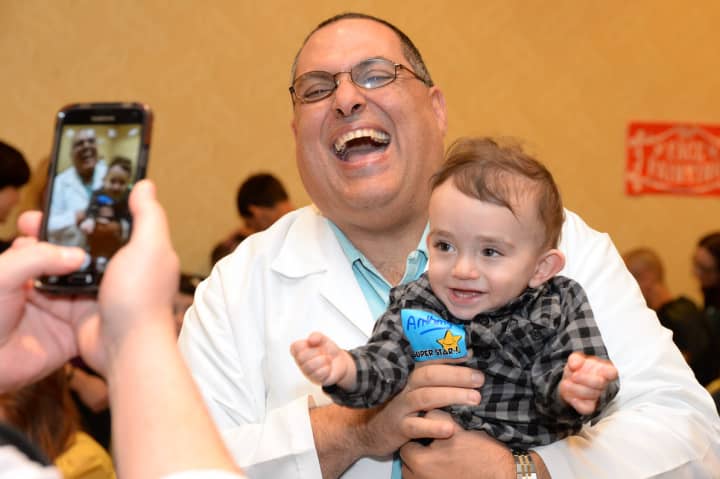 Director of Neonatology at White Plains Hospital Dr. Jesus Jaile-Marti, of Hartsdale, laughs with NICU graduate Anthony Forgione, also of Hartsdale.