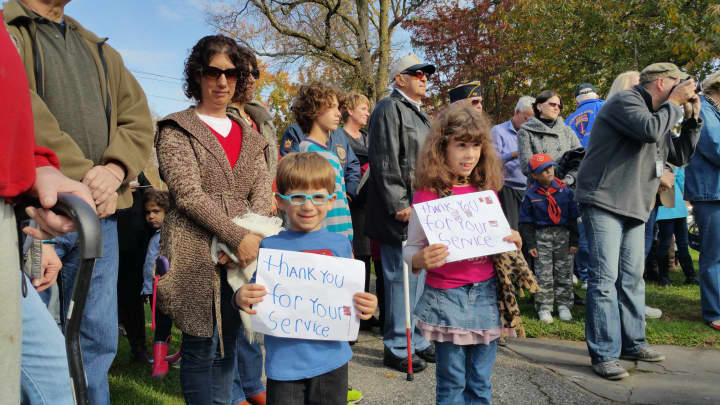 Diana Palmentiero and with her kids Cody and April celebrate Veterans Day at the town ceremony, Tues day, Nov. 11.