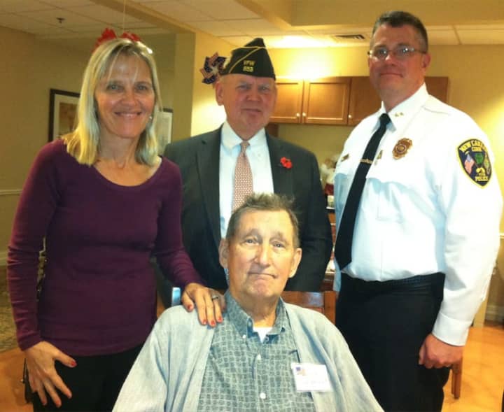 Don Charhut, a veteran of the U.S. Army and a resident at Brighton Gardens in Stamford, is one of the veterans honored in a ceremony Tuesday on Veterans Day. From left are his daughter: Christina Fagerstal, Peter Langenus and Leon Krolikowski.
