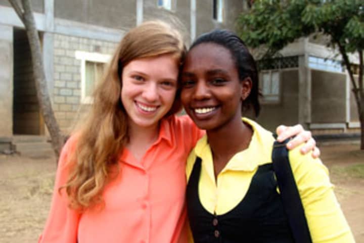 Mary Grace Henry with a student in Africa.