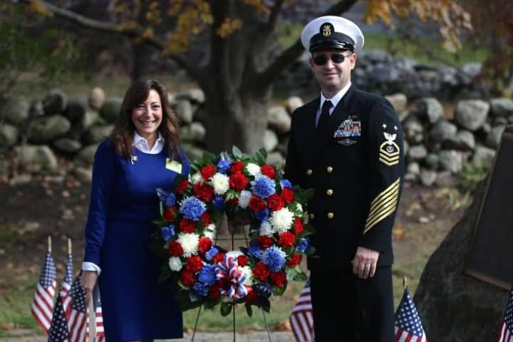Weston First Selectman Gayle Weinstein and Andrew Cumming present a wreath during Veterans Day ceremonies at Weston Middle School.