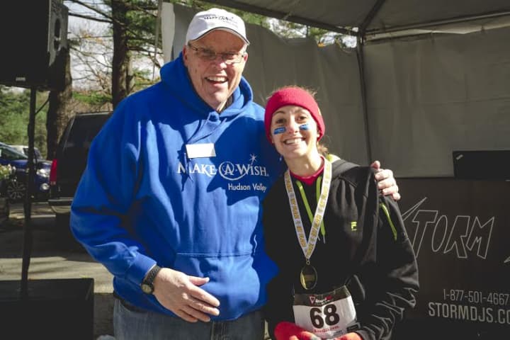 Yorktown Heights resident winner Melissa Dimarino, 24, who came in first place in the female age category. Her time was 27:36. She is shown with Thomas Conklin, Executive Director of the Make-A-Wish Hudson Valley. 