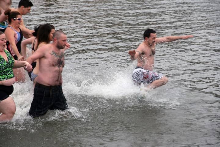 New Rochelle plungers will take the same freezing dip that these Peekskill residents did last year.