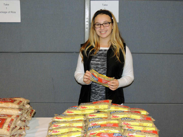 Rebecca Sklar, 13, of Scarsdale serves as a teen volunteer helping the younger kids fill bags. 
