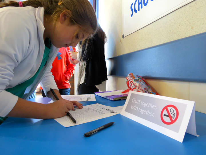 A Briarcliff middle schooler signs a pledge to not use tobacco products for a year. 