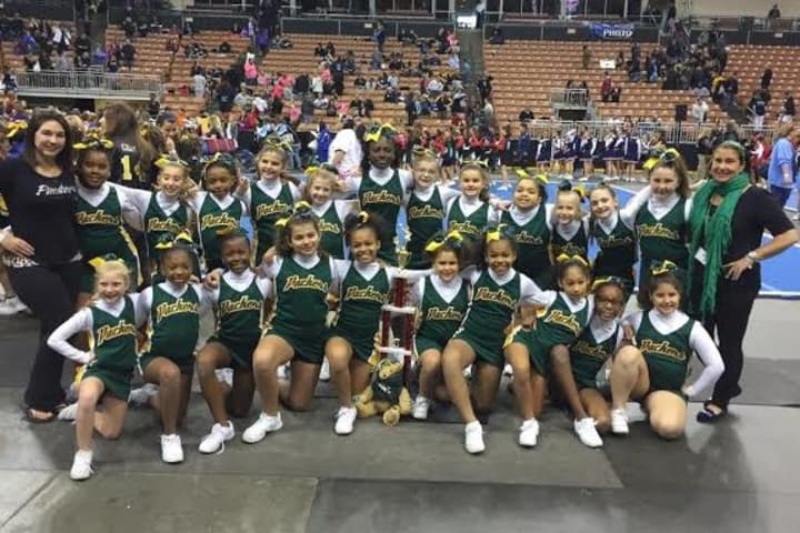 The Norwalk Packers under-10 cheerleading team won the New England Regional title Saturday in New Hampshire. 