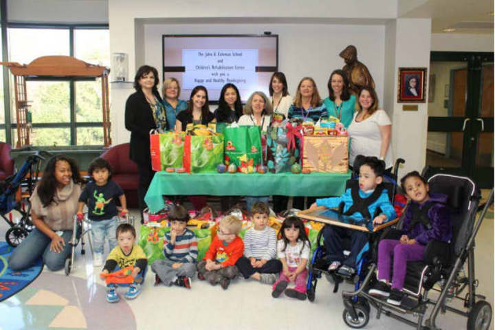 Staff and students from the John A. Coleman Schools White Plains campus and the Childrens Rehabilitation Center with some of the Thanksgiving dinners that are ready to go home.