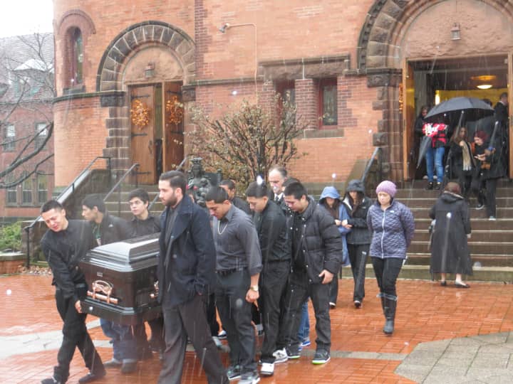 Friends and relatives of Joseph M. Touri, 18, carry his casket from Our Lady of Mercy Church in Port Chester on Wednesday.