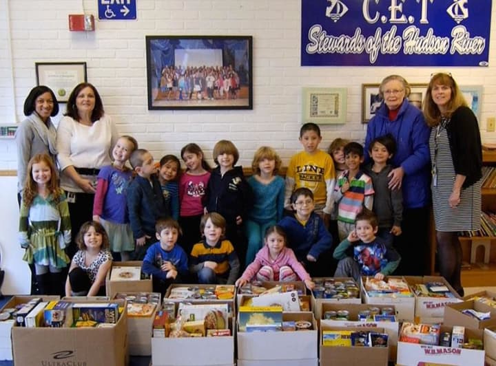 Carrie E. Tompkins Elementary School social worker Renee Tanner, second from left, students and faculty with the food donations collected through a partnership with the Croton Caring Committee.