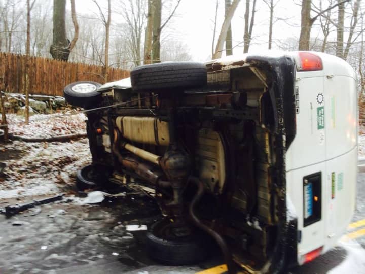 A van was overturned after an accident Wednesday on Georgetown Road in Weston. 