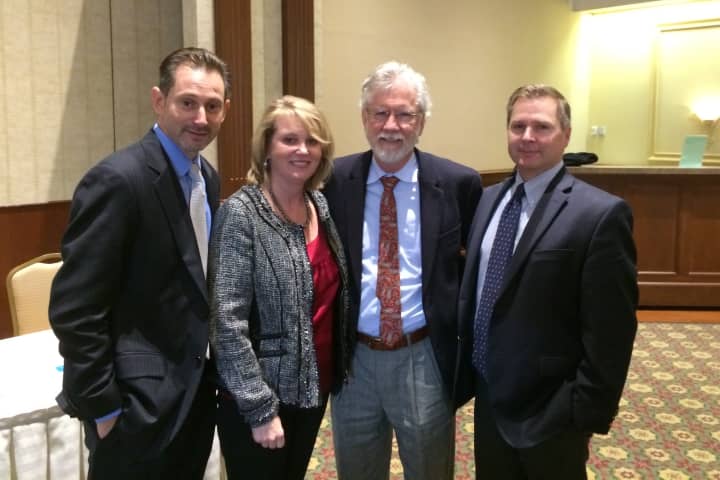 John Pellegrino, 2015 president, left, meets, from left, Thaddea Sheridan, 2014 president; John Glascock; and John Harness.