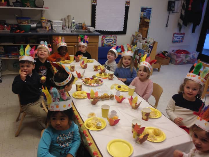 The Chapel School preschoolers enjoy their Thanksgiving feast.