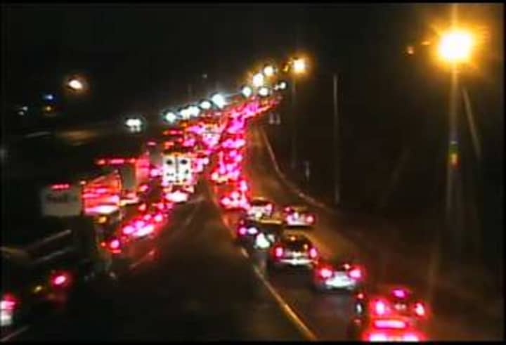Traffic is jammed at about 8:25 p.m. on I-84 west near Exit 6 in Danbury after a truck struck and killed a woman. 