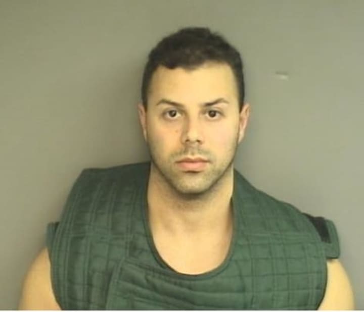 Anthony Manousos, 33, is charged with first-degree arson and is held on $500,000 bond on charges of trying to burn the home he owns at 52 Highland Road.