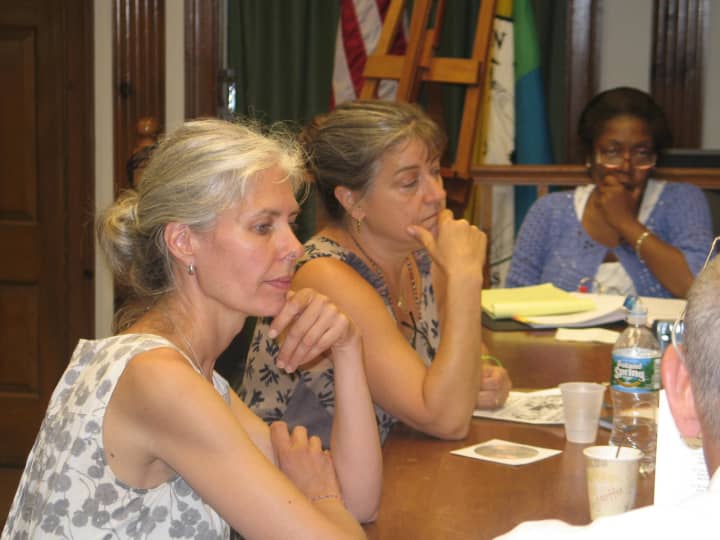 Teresa Ambrose (center) discusses her plans for a chicken coop with Yorktown Town Board.