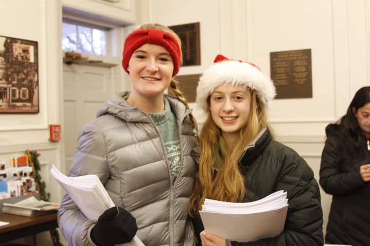 Girl Scouts Hannon Eberts, left, and Cassie Panzarino of Somers hand out programs at the Elephant Hotel.