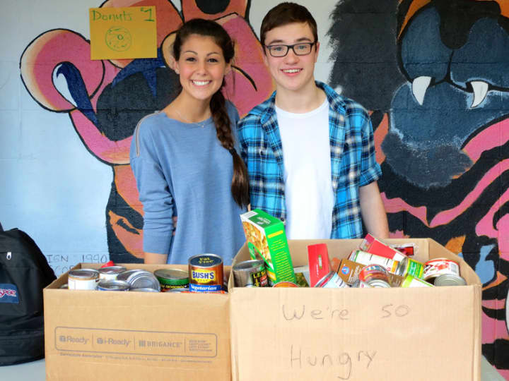 North Salem students collect food items to be donated to the local Lions Club during a badminton tournament.