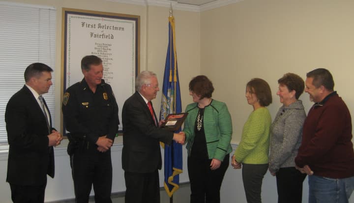 First Selectman Michael Tetreau and other town officials receive a plaque from Mothers Against Drunk Driving.