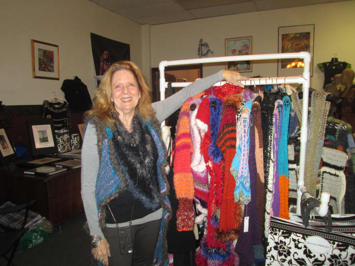 Susan Obrant, in front of her clothes at her gallery in Peekskill. 