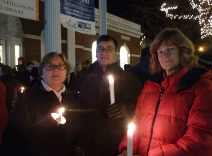 Greenwich residents, from left Judy and Peter Berg and Phyllis Behlen, attend the Stamford Vigil of Hope on Thursday evening to prevent gun violence.